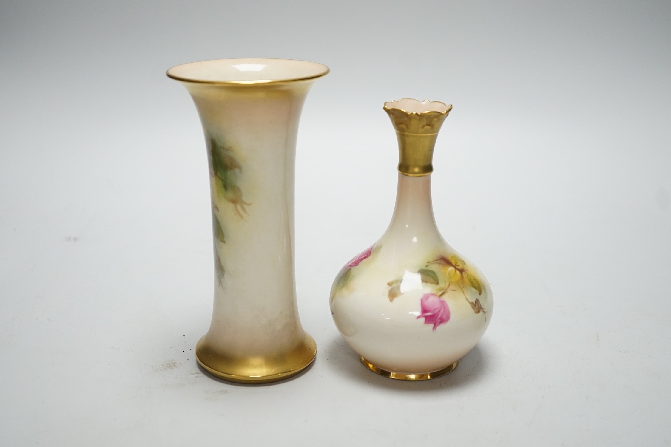 A Royal Worcester trumpet vase, shape G923 painted with roses by M. Hunt, signed, date code 1925 and another vase, shape G702 painted with roses, date code 1924, tallest 16cm